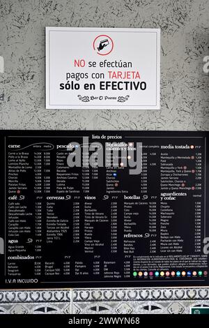 Sign in restaurant bar that no car payments, only cash along with menu Spain Stock Photo