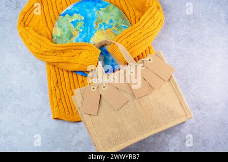 Close up collection of tags on an eco bag. Creative concept buy less and overconsumption. Responsible consumption. Save the planet. top view Stock Photo