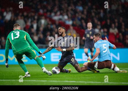 LONDON, UK - 26th Mar 2024:  Ivan Toney of England goes down under the challenge of Jan Vertonghen of Belgium and wins a penalty during the International Football Friendly match between England and Belgium at Wembley Stadium  (Credit: Craig Mercer/ Alamy Live News) Stock Photo