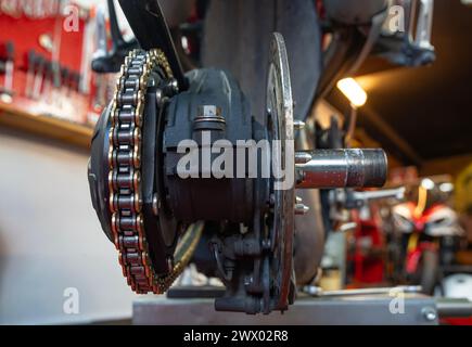 Motorcycle brake and  system, disc. caliper rim and chassis, repair time at workshop Stock Photo