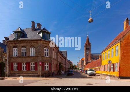 District Nyboder with yellow historic row houses and St Paul Church in Copenhagen, Denmark Stock Photo