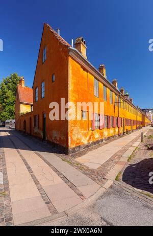 District Nyboder with yellow historic row houses in Copenhagen, Denmark Stock Photo
