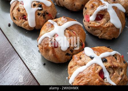 Homemade traditional hot cross buns with fruit and raisins. Stock Photo