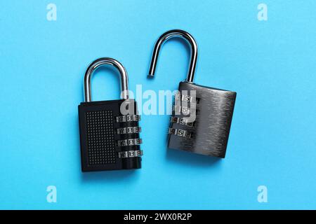 Steel combination padlocks on light blue background, top view Stock Photo