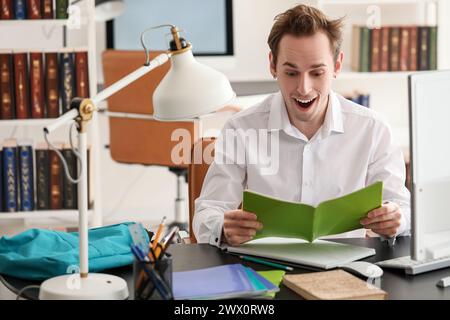 Male student preparing for exam  at home Stock Photo