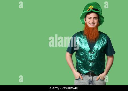 Young man in hat with red beard on green background. St. Patrick's Day celebration Stock Photo