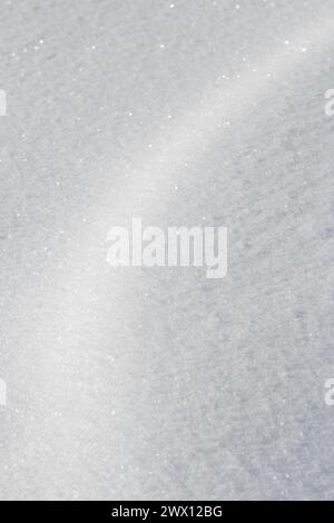 Curve of light on fresh white snow texture background Stock Photo