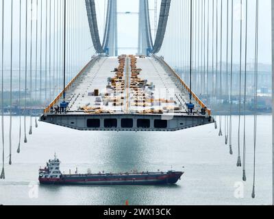 Beijing, China. 26th Mar, 2024. An aerial drone photo taken on March 26, 2024 shows the construction site of Longtan bridge in Yizheng of east China's Jiangsu Province. Credit: Meng Delong/Xinhua/Alamy Live News Stock Photo