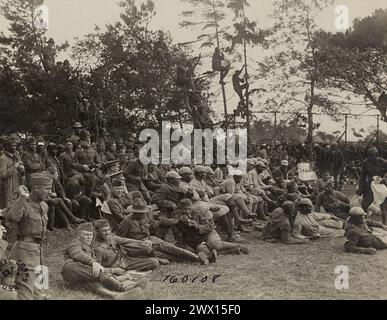 Crowd watches league champion baseball game, one team made up of African-American soldiers in the foreground; Savenay, Loire Inferieure, France ca. 1919 Stock Photo