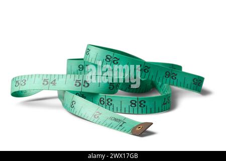 green color sewing tape measure, flexible and vinyl essential tool for sew or crafting measurements with metal caps or tabs on ends, selective focus Stock Photo