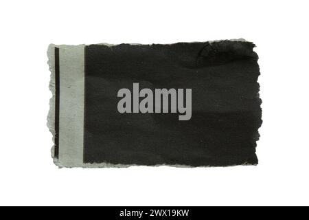 Torn black newspaper on white background with clipping path Stock Photo