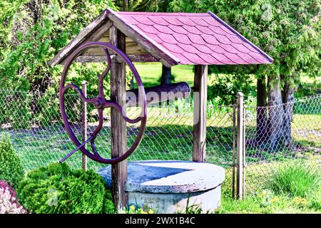 Wooden well in a Polish village in the Podkarpackie Voivodeship. Stock Photo