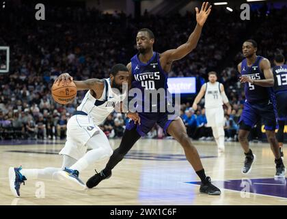 Sacramento, Ca, USA. 26th Mar, 2024. Dallas Mavericks guard Kyrie Irving (11) drives against Sacramento Kings forward Harrison Barnes (40) during a game at Golden 1 Center on Tuesday, March 26, 2024 in Sacramento. (Credit Image: © Paul Kitagaki Jr./ZUMA Press Wire) EDITORIAL USAGE ONLY! Not for Commercial USAGE! Stock Photo