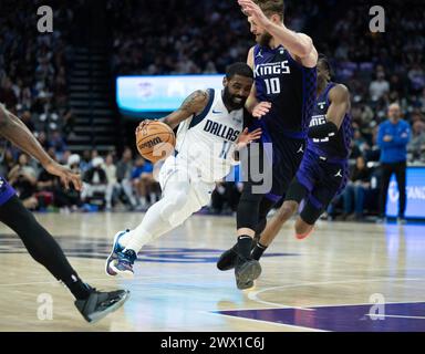 Sacramento, Ca, USA. 26th Mar, 2024. Dallas Mavericks guard Kyrie Irving (11) drives against Sacramento Kings forward Domantas Sabonis (10) during a game at Golden 1 Center on Tuesday, March 26, 2024 in Sacramento. (Credit Image: © Paul Kitagaki Jr./ZUMA Press Wire) EDITORIAL USAGE ONLY! Not for Commercial USAGE! Stock Photo