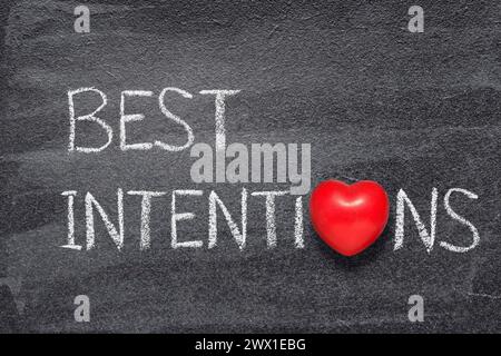 best intentions phrase written on chalkboard with red heart symbol Stock Photo