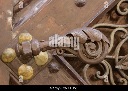 rusty old metal latch on antique door Stock Photo