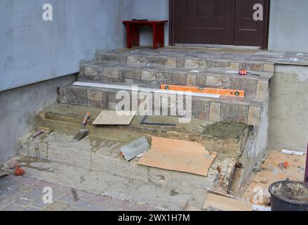 put on the stairs gray tiles, tools on the stairs Stock Photo