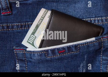 in the back pocket of jeans, a purse with money Stock Photo