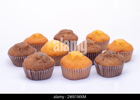 Fresh tasty chocolate muffins cakes on white isolated background. Stock Photo