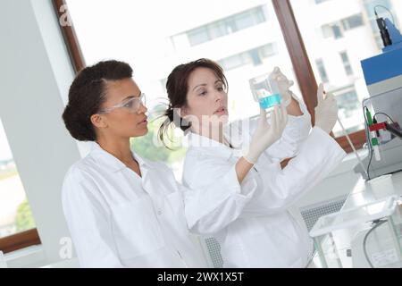 two young female scientist doing experiments in lab Stock Photo