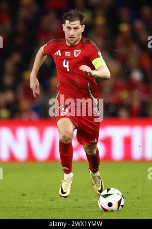 Cardiff, UK. 26th Mar, 2024. Jordan James of Wales tussles with Bartosz ...