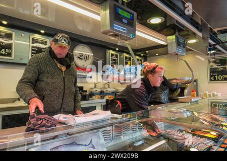Kiosk selling New Dutch Herring in Harderwijk in the Netherlands. Dutchs eat their raw fish on a bun or as a snack with some onions Stock Photo