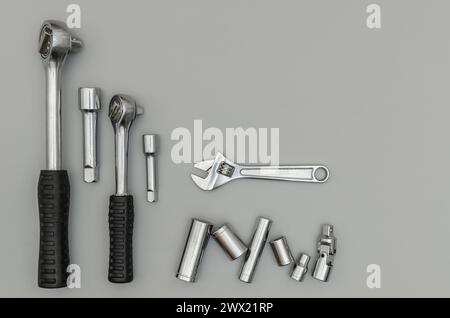 Top view of a set of many different tools on a light gray table. Place for text Stock Photo