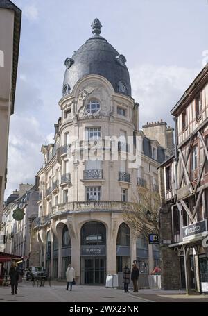 annes, France - Mar 26, 2024: People walking in Vannes. Streets and buildings. Lifestyle in the urban area. Cloudy spring day. Selective focus Stock Photo