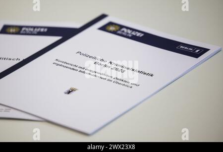 Berlin, Germany. 27th Mar, 2024. Editions of the crime statistics lie on a table at a press conference to present the police crime statistics and politically motivated crime 2023 in Berlin. Credit: Hannes P. Albert/dpa/Alamy Live News Stock Photo