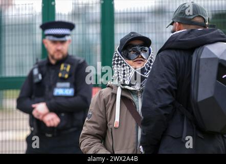 Sandwich, UK. 26th Mar, 2024. Supporters of those involved in the action talk outside one of the access gates watched by a police officer during the demonstration. Instro Precision provide components for Elbit Systemís weaponry. Palestine Action continues to target subsidiary companies of Israeli arms company Elbit Systems in an attempt to isolate them and make business impossible. This tactic has caused two of Elbit's ten main businesses to close in the UK and several partner companies to cut ties with them. Credit: SOPA Images Limited/Alamy Live News Stock Photo