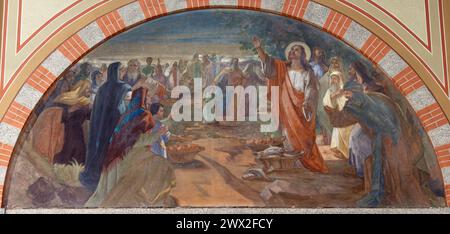 MILAN, ITALY - MARCH 6, 2024: The fresco of miracle Feeding the multitude  in the church Chiesa del Redentore by  Angelo Galloni (1950). Stock Photo