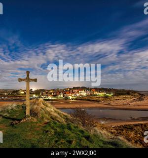 A night time view of Alnmouth in northumberland from Church Hill under a full moon looking north over the village Stock Photo