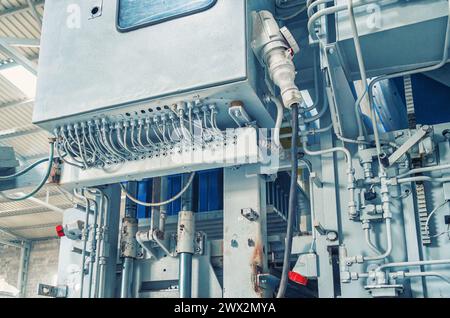 Control unit for large industrial equipment. The wires are connected to the control unit Stock Photo