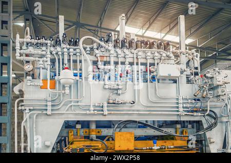 Part of equipment under pressure. Factory shop with industrial equipment, pressure gauges, pipes Stock Photo