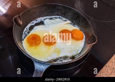 A frying pan with two double yolk eggs. Stock Photo