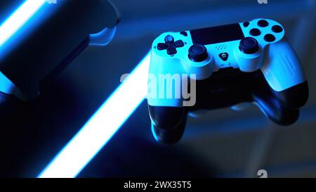 Gamepad on abstract background with light effects. Gamer and Game concept. Gaming background with copy space Stock Photo