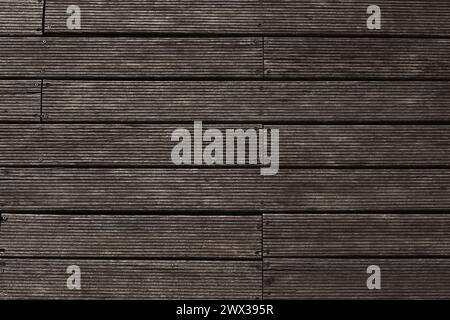 wooden planks cut and fastened with rusty nails and screws. Brown wood backgroud texture background Stock Photo