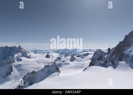 View from the La Vierge descent across the glaciers in the Vallee Blanche in Chamonix toward the border to Switzerland and the Swiss Alps Stock Photo