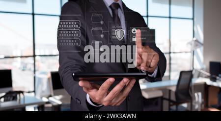 Data protection concept. businessman holds tablet and tries to access protected files. Stock Photo