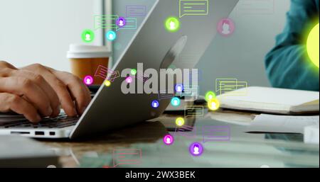 Image of profile icons and message boxes over diverse coworkers using digital tablet and laptop. Digital composite, multiple exposure, business, abstr Stock Photo