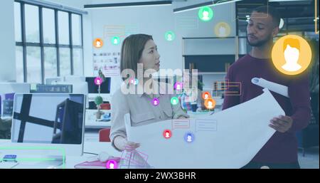 Image of profile icons and message boxes, diverse architects discussing floor plan on blueprint. Digital composite, multiple exposure, business, plann Stock Photo