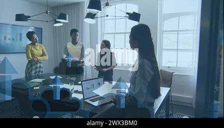 Image of arrow on clouds over diverse female coworkers discussing reports in office. Digital composite, multiple exposure, business, direction, cloud Stock Photo
