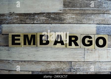 Concept of The wooden Cubes with the word Embargo on wooden background. Stock Photo