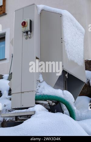 snow on a heat pump Stock Photo