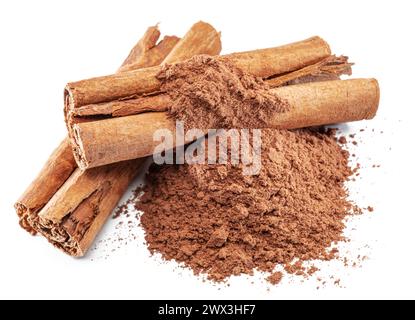 Cinnamon spice -dried bark strips and ground cinnamon isolated on white background. Stock Photo