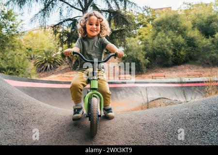 Kids riding on pump bike track Stock Photo Alamy