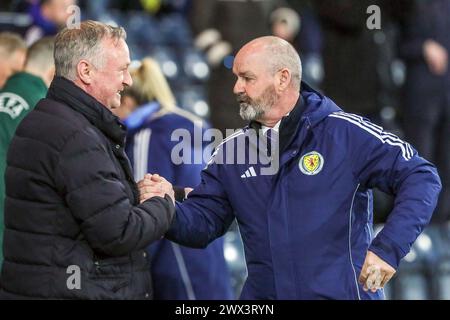 Steve Clarke (right) , Coach for the Scotland National football team, in conversation with Michael O'Neill (left), coach of the Northern Ireland Stock Photo