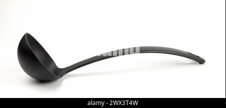 Black plastic ladle, kitchen utensils. Stock Photo