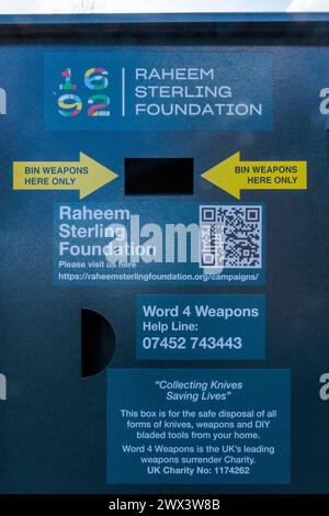 Knife Amnesty Bin, Wembley, Brent, UK. 27th March 2024. An initiative by a charity set up by England footballer Raheem Sterling has installed seven knife amnesty bins in Brent. The project, to provide a safe and anonymous place to dispose of knives as well as information on education, employment and social mobility opportunities, is a partnership between the Raheem Sterling Foundation and Word 4 Weapons, a leading weapons surrender charity. One of the bins, near Wembley Stadium, is close to where Raheem Sterling attended Copland School, now Ark Elvin Academy. Photo: Amanda Rose/Alamy Live News Stock Photo