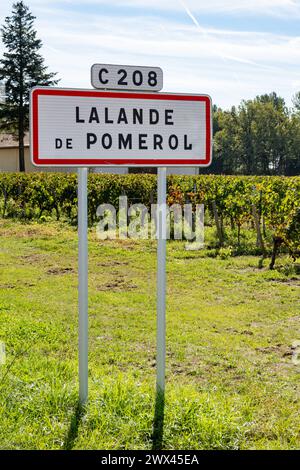 City road sign Lalande de Pomerol near Saint-Emilion wine making region, growing of Merlot or Cabernet Sauvignon red wine grapes, France, Bordeaux in Stock Photo